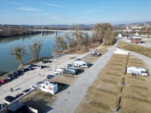 an aerial view of a parking lot next to a river at Baumgartner Camping am Inn in Schärding +6 photos