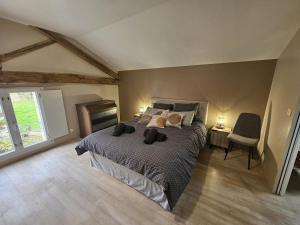 a bedroom with a large bed in a room at Villa nest in Saint-Sauvant +29 photos