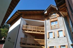 a building with balconies on the side of it at Cadari' Appartamenti in Castel Condino