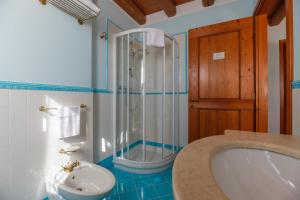 a bathroom with a tub and a shower and a toilet at Agriturismo Althea in Vittorio Veneto +53 photos