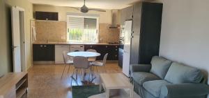 a living room with a couch and a table at Eva luna san juan in Alicante