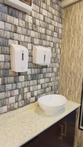 a bathroom with a white sink on a counter at Simla 16 in Lautoka