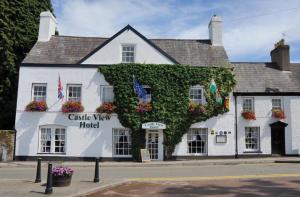 a building with ivy on the side of it at Castle View Hotel in Chepstow