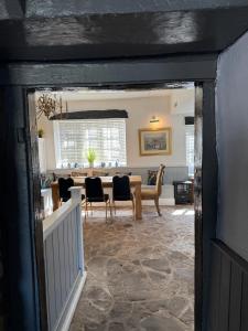 a dining room with a table and chairs at Castle View Hotel in Chepstow