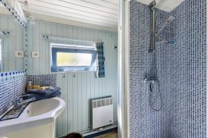 a bathroom with a sink and a shower at Le Grand Pré du Clos Champêtre in Longué +19 photos