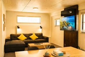 a living room with a couch and a table at Serene Star in Lake Tekapo