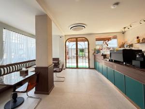 a lobby with a bar and a waiting room at Ranana Bangkok in Bangkok
