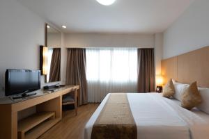 a hotel room with a bed and a television at Kantary Hotel Kabinburi in Kabin Buri +43 photos