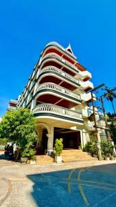 a large building with balconies on the side of it at APK Resort in Patong Beach