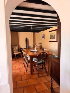 a dining room with a table and chairs at Sweet Lamb Farmhouse in New Ross +25 photos