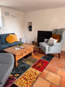 a living room with a couch and a coffee table at Sweet Lamb Farmhouse in New Ross