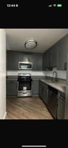 a kitchen with a sink and a stove top oven at Central LA Shared Living #2 in Los Angeles