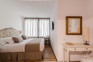 Posteľ alebo postele v izbe v ubytovaní Suite Home Sardinero