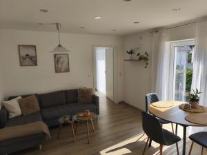 a living room with a couch and a table at Herdecke, Ruhrperle in Herdecke