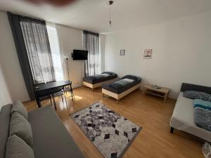 a living room with a couch and a table at Palace Apartment in Vienna