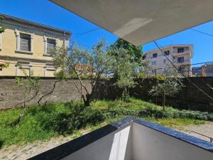 a view of a garden from the balcony of a house at N'Shkoder in Shkodër