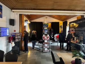 a group of people standing in a store at Sjømannskirken Narvik in Narvik