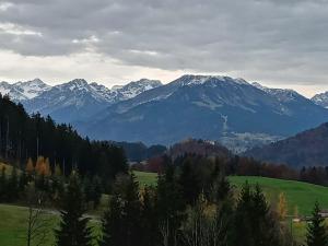 a view of a mountain range with snow covered mountains at Turmfalke in Germaringen