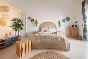 a bedroom with a large bed in a room at Corina Secret Rooms in Martano