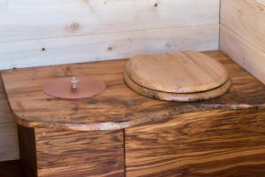 a wooden toilet sitting on top of a wooden table at Magnifique kiosque verdoyant in Semur-en-Auxois