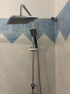a shower with a faucet in a bathroom at Panorama House in Pramanta