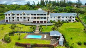 an aerial view of a large house with a swimming pool at Barefoot Bay Pumula in Pumula