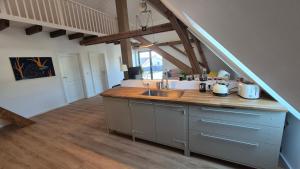 a kitchen with a sink and a counter top at Ferienwohnung Melle - Westerhausen in Melle