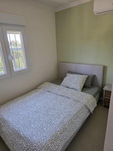 a bedroom with two beds and a window at Eva luna san juan in Alicante