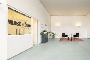 a hallway with a wasatch arena sign on a window at Hotel Krone in Pforzheim