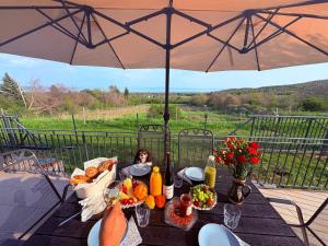 a table with a bunch of food on top of it at Haptapta House in Balatonudvari