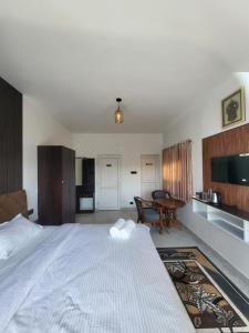 a bedroom with a large bed and a table at The heights holidays in Kodaikānāl +50 photos