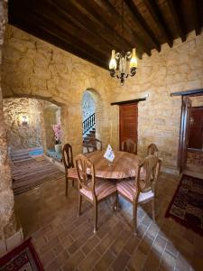 a dining room with a wooden table and chairs at Tunis Village,lake view countryside villas in Tunis