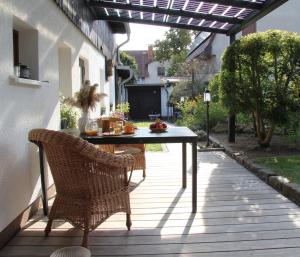 a table and two chairs on a patio at Ferienhaus Hartmut Löschke in Rheinsberg