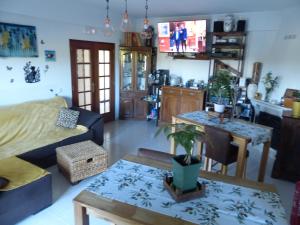 a living room with a couch and a table at Sandra B&B in Luz de Tavira