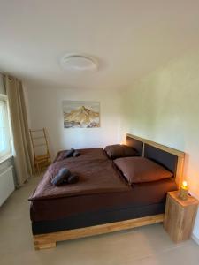 a bedroom with a large bed in a room at Schönblick in Oberaichwald