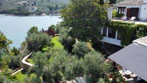 an aerial view of a house next to a lake at Villa Mitzela in Amaliapoli