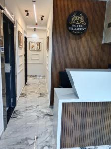 a corridor of a hotel with a marble floor at Hotel Bellemount in Ahmedabad