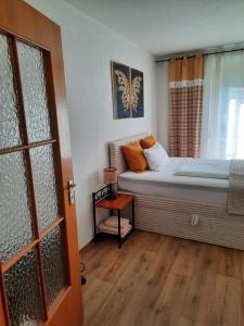 a bedroom with a bed and a window and a door at Augsburg!Möblierte Appartment! in Augsburg