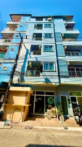 a large blue building with a lot of windows at Silver Oaks Hotel in Patong Beach