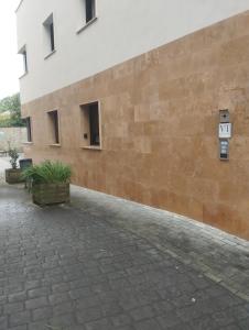 a brick wall with a sign on the side of a building at Apartamento Markina Xemein in Marquina-Jemein