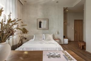 a bedroom with a large bed in a room at Ederlezi Boutique Hotel in Athens