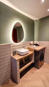 a bathroom with a sink and a washing machine at Villa Elizabeth Apartments in Ouranoupoli +39 photos