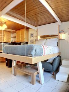 a bed on a table in a room at Ladybird Inn in Chamonix +10 photos