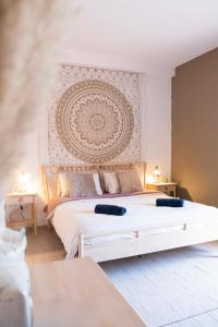 a bedroom with a white bed with a large headboard at Boutique Cortijo Meliora in Cantoria +120 photos
