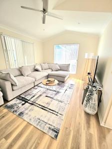a living room with a couch and a table at Serena Shores Holiday Escape in St Georges Basin