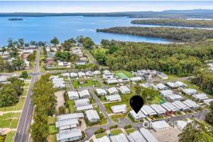 an aerial view of a campground next to a lake at Serena Shores Holiday Escape in St Georges Basin