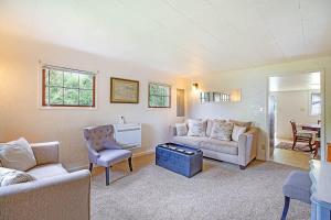 a living room with a couch and a table at You Won't Be Crabby After Staying Here in Westport +11 photos