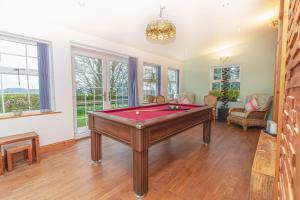 a living room with a pool table in it at Navitie Apartment in Ballingry