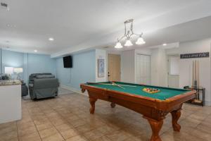 a living room with a pool table in it at Heron Landing in Corolla