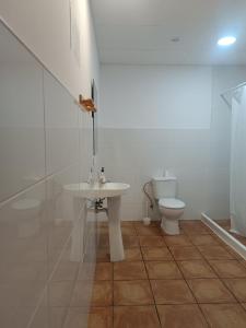a bathroom with a sink and a toilet at Nest Room in Alicante
